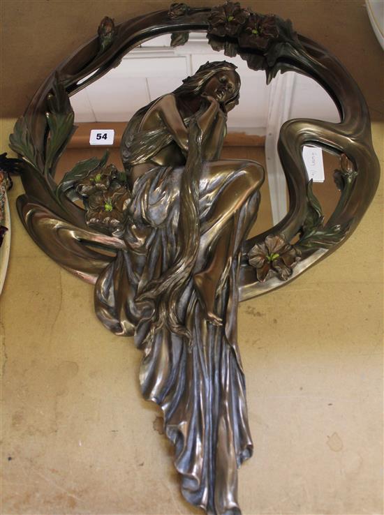 Circular wall mirror with seated figure